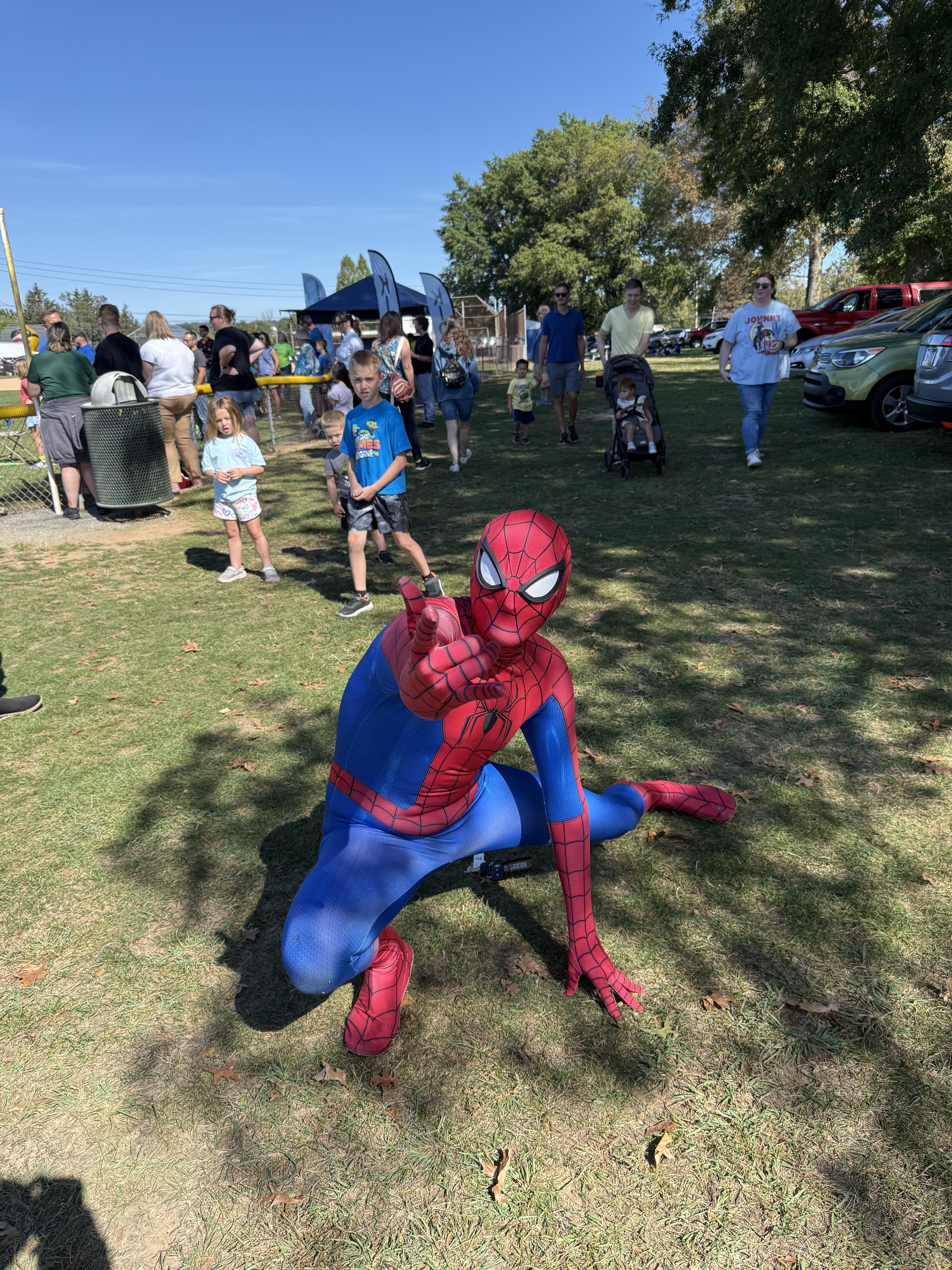 Spider-Man character posing with kids at Coopersburg Community Day